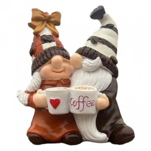 Two coffee gnome figurines holding mugs with coffee-themed hats